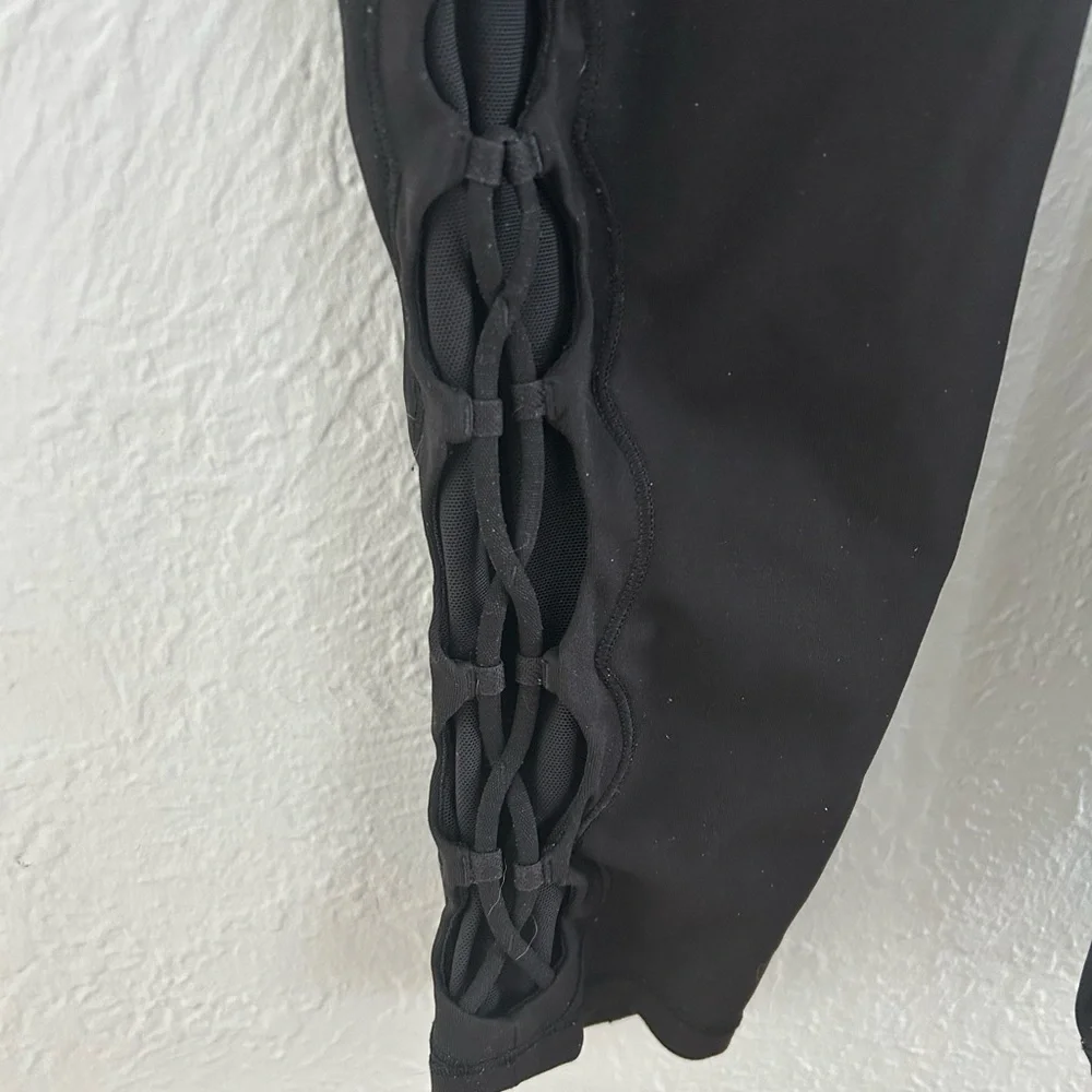 Lululemon Black Tied to It leggings.  Women's size 6, great condition!